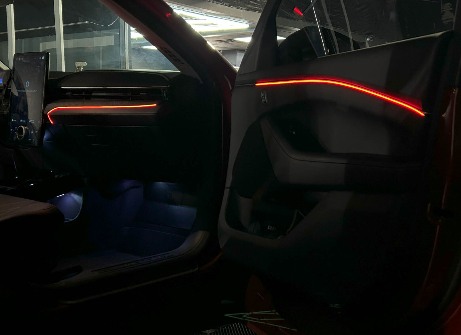 Ambient door lighting glowing in a dark interior